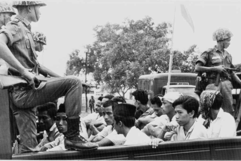 Members of the youth wing of the Communist Party of Indonesia guarded by soldiers on their way to prison in Jakarta on October 30, 1965 as part of a crackdown on communists. Photo: AP