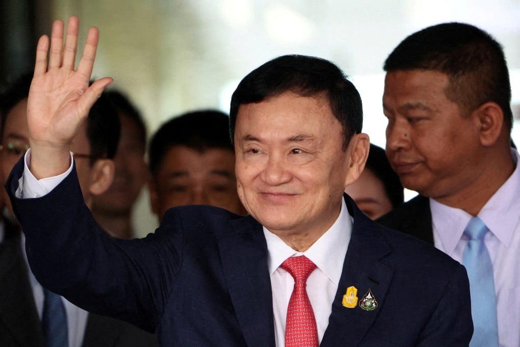 Former Thai prime minister Thaksin Shinawatra waves at Don Mueang airport in Bangkok on August 22. Photo: Reuters