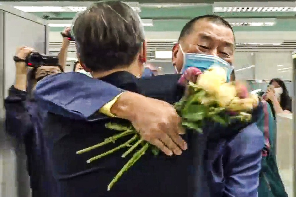 Jimmy Lai (right) hugs Apple Daily ex-publisher Cheung Kim-hung. Cheung has became a prosecution witness against his former boss. Photo: Facebook