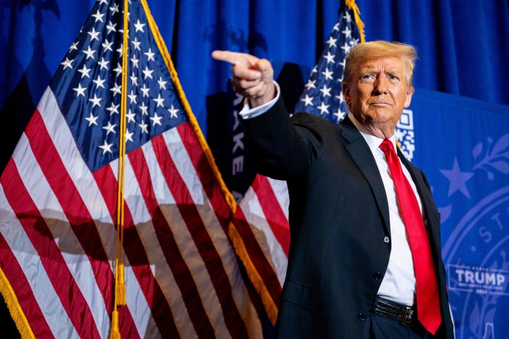 Former US President Donald Trump points to supporters at a campaign rally in Atkinson, New Hampshire. Photo: AFP