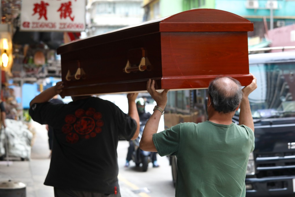 Funeral service staff carry a coffin in Hung Hom. Hong Kong’s antitrust watchdog raided several businesses in the area on Wednesday. Photo: Yik Yeung-man