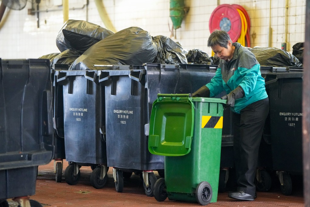 A worker at the Kowloon City Road Refuse Collection Point. A property management representative has raised concerns that a new waste-charging scheme may increase cleaners’ working hours. Photo: Sam Tsang
