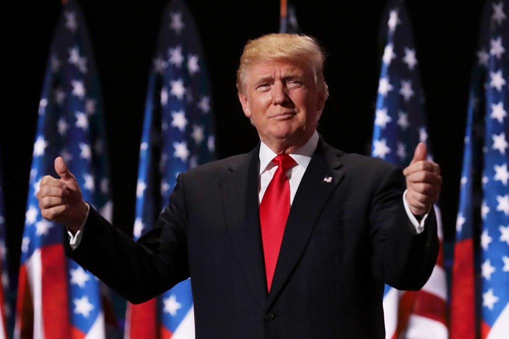 Then Republican presidential candidate Donald Trump gives two thumbs up at his party’s convention in Cleveland, Ohio, on July 21, 2016. Photo: TNS