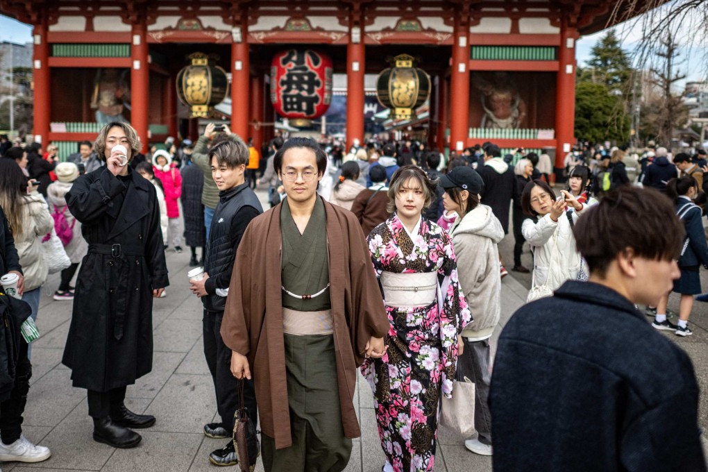 A couple wears kimonos as they visit Sensoji Temple in Tokyo. One of the often-cited causes on why Japanese prefer to remain single and thus contribute to the country’s population decline is the lack of finances to marry and raise children. Photo: AFP