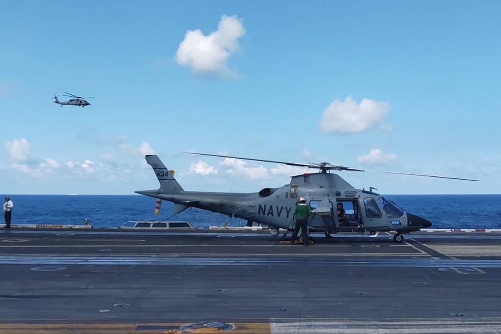 A Philippine Navy AW109 helicopter is pictured on January 4 on the deck of the USS Carl Vinson during joint military exercises. The PLA  sent its navy and air force to monitor activities. Photo: Armed Forces of the Philippines/AFP