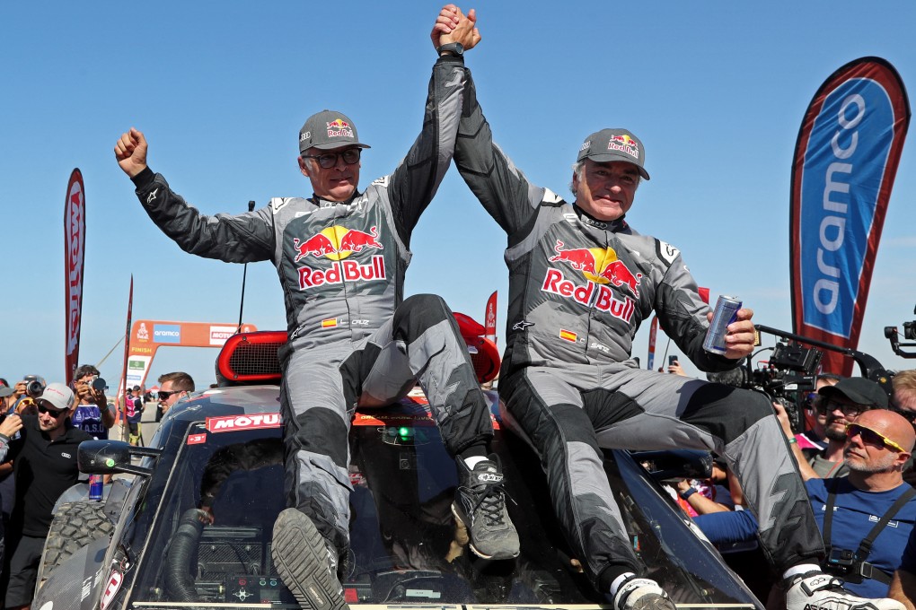 Carlos Sainz (right) and co-driver Lucas Cruz celebrate after winning the car category at the Dakar Rally. Photo: Reuters