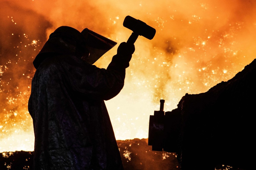 An employee at the Tata Steel Port Talbot integrated iron and steel works in south Wales, UK. Photo: AFP