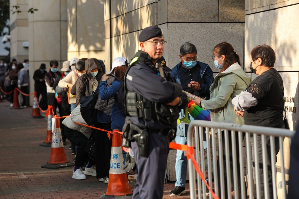 Police and members of the public outside West Kowloon Court. Prosecutors allege Jimmy Lai was the mastermind of an anti-China conspiracy linked to Apple Daily. Photo: Xiaomei Chen