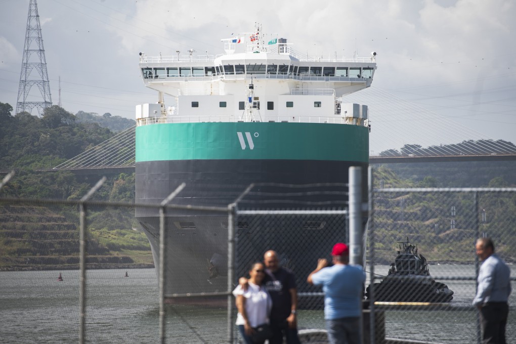 A cargo ship is guided through the Panama Canal, in Panama City, on Wednesday. A severe drought that began last year has forced authorities to slash ship crossings by over a third in the canal, one of the world’s most important trade routes. Photo: AP