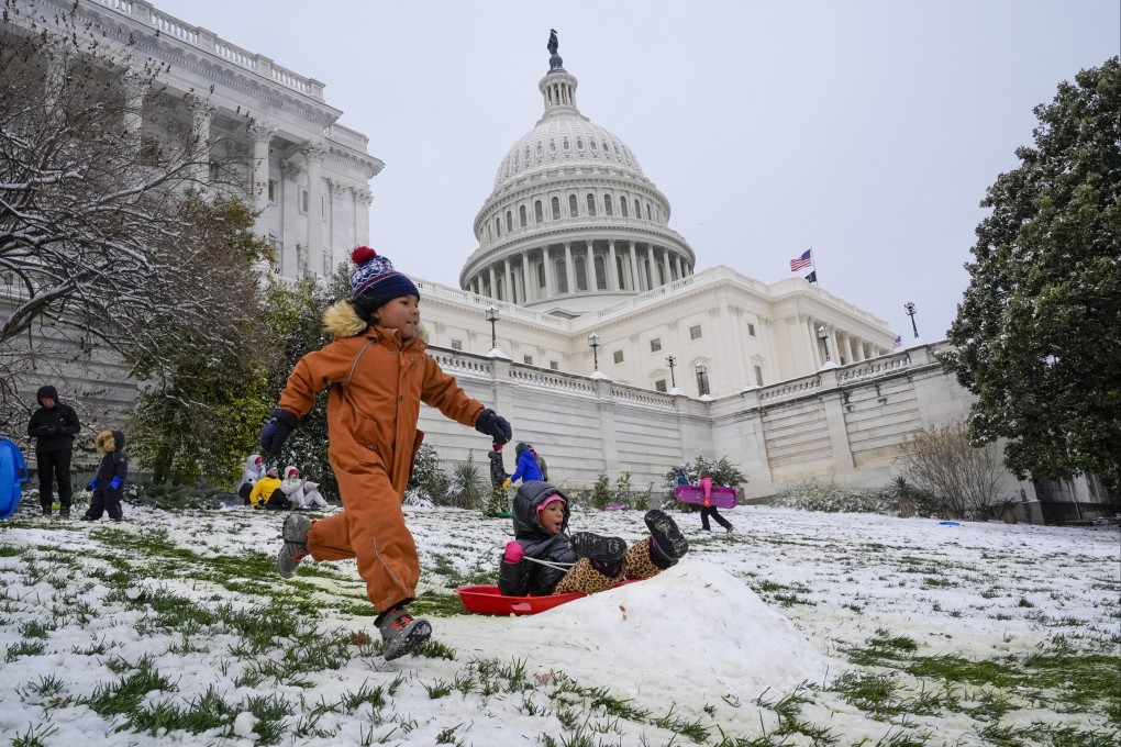 Children race each other down the sledding hill at the US Capitol in Washington. Photo: AP