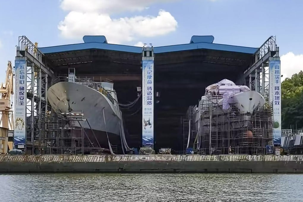 A Type 054B frigate (left) is nearly completed at a drydock in a Guangzhou shipyard. It is docked next to a smaller Type 054A that is being built for the Chinese coastguard. Photo: Sina Weibo