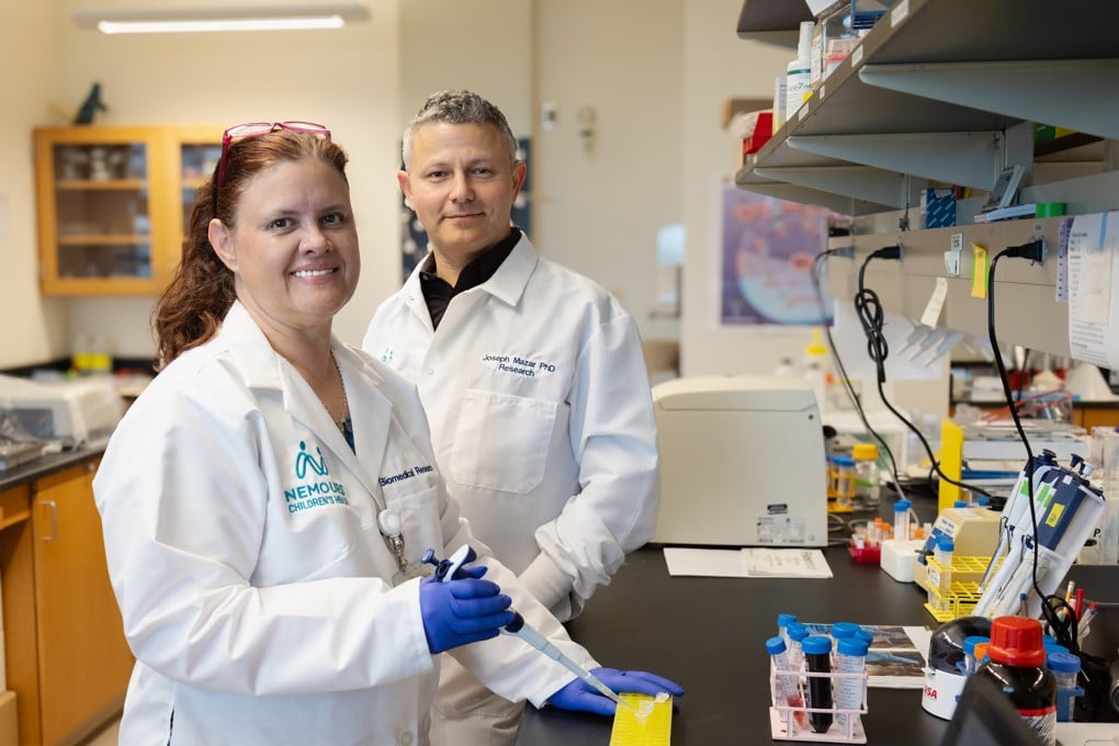 Tamarah Westmoreland and Joseph Mazar are studying whether the Zika virus can shrink neuroblastoma tumors at Nemours Children’s Health in Orlando, Florida. Photo: Nemours Children’s Health via TNS