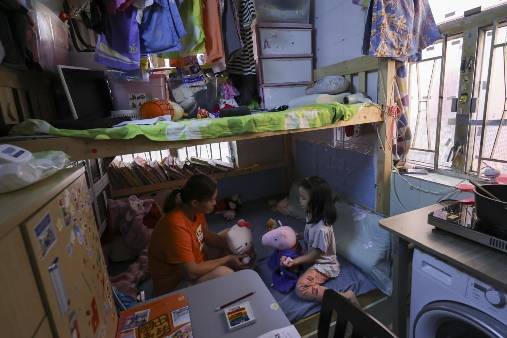 A mother and daughter reside in a subdivided flat in Sham Shui Po. Members of an activist group have urged the government to step up law enforcement against errant landlords. Photo: May Tse