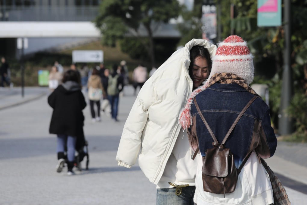 People opt for warm clothes at West Kowloon during chilly weather in December. The forecaster says  cool and rainy weather will persist in the latter part of next week. Photo: Xiaomei Chen