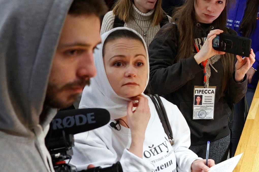 Maria Andreyeva, whose husband was mobilised in October 2022 to join Russia’s war in Ukraine, visits the election headquarters of President Vladimir Putin in Moscow on Saturday with other women to demand the return from the frontline of their partners, sons and brothers. Photo: Reuters