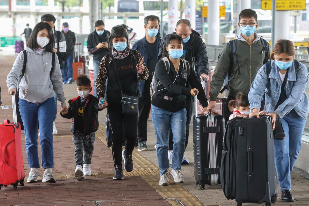 People wheel suitcases near the Shenzhen Bay crossing. A source says the checkpoint will be open 24 hours during the holiday period. Photo: K. Y. Cheng