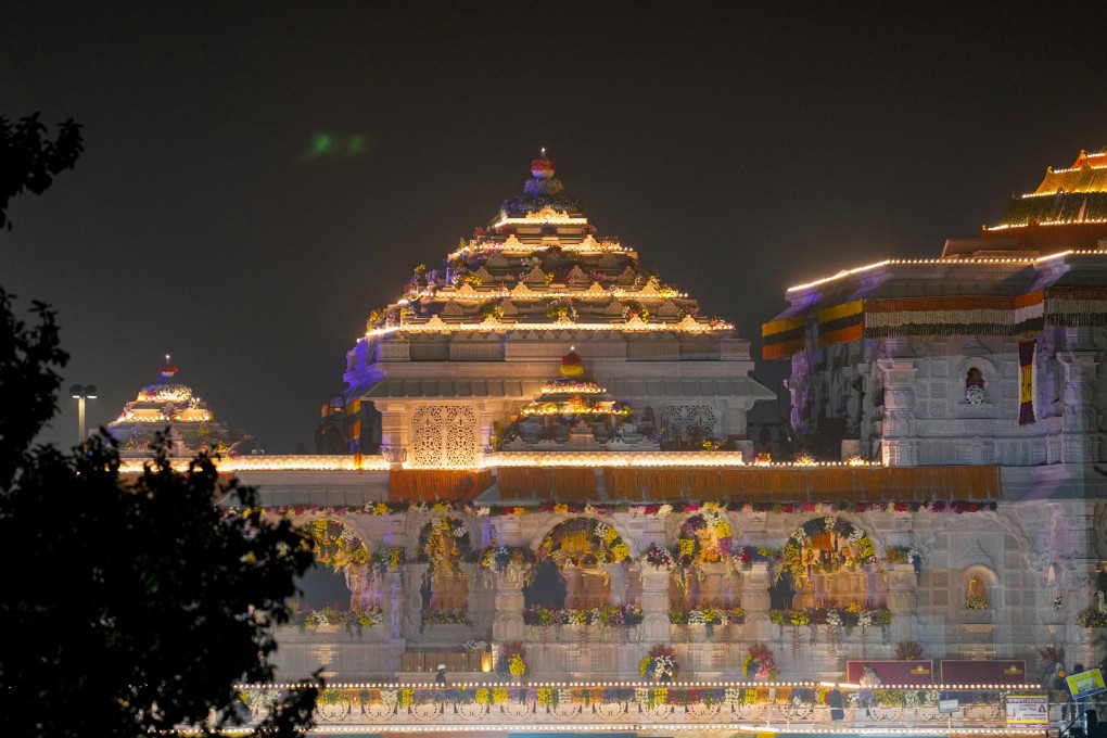 A temple dedicated to Lord Ram in Ayodhya, India, is lit up on Saturday, two days before its grand opening. Photo: AP