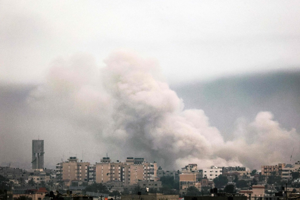 Smoke billows over Khan Yunis in the southern Gaza Strip during Israeli bombardment on Sunday. Photo: AFP