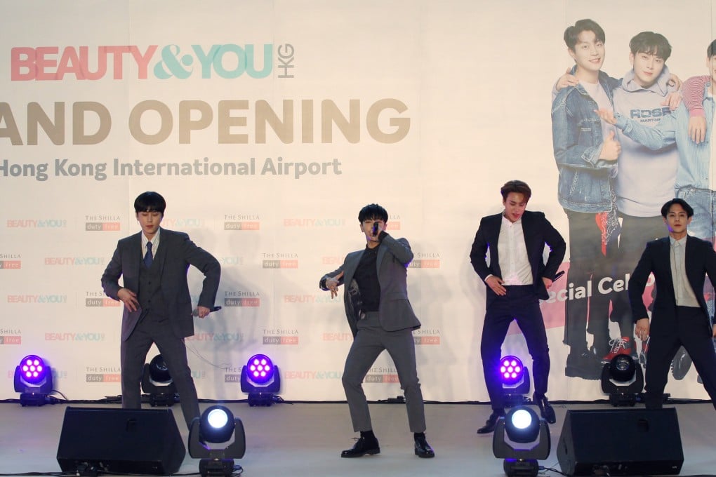 K-pop boy band Highlight at the Hong Kong International Airport in 2018. The openness of K-pop stars about their love lives gained renewed attention when solo artist HyunA shared posted an image on Instagram of herself and former Highlight member Yong Jun-hyung (left) holding hands at a beach. Photo: SCMP/Roy Issa