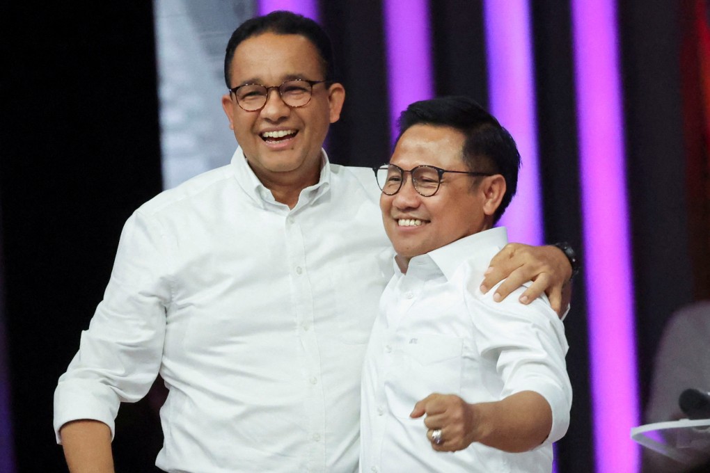 Presidential candidate Anies Baswedan and his running mate Muhaimin Iskandar react during a televised debate on Sunday. Photo: Reuters