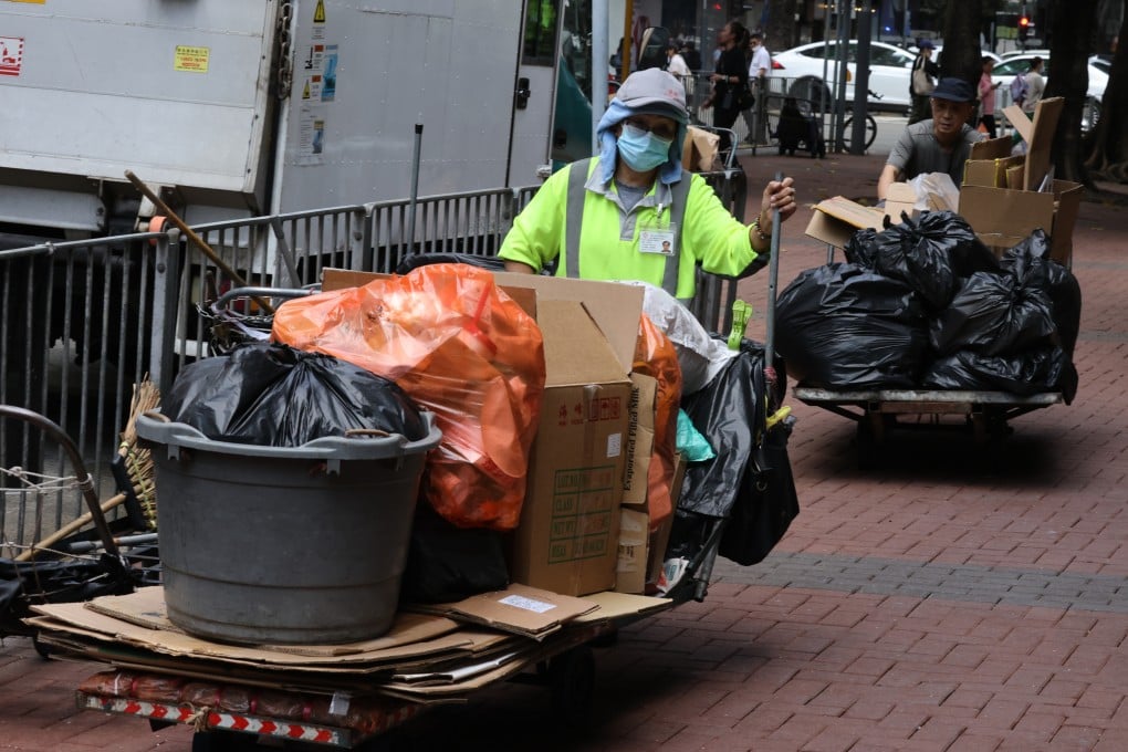 Workers take household waste to the Luard Road Refuse Collection Point in Wan Chai on January 19. Photo: Yik Yeung-man