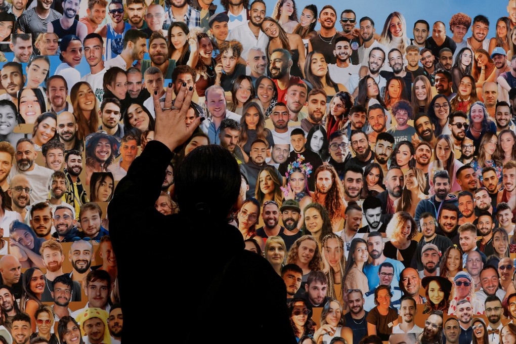 Photos of people who were killed and kidnapped during the October 7 attack by Hamas gunmen. Photo: Reuters