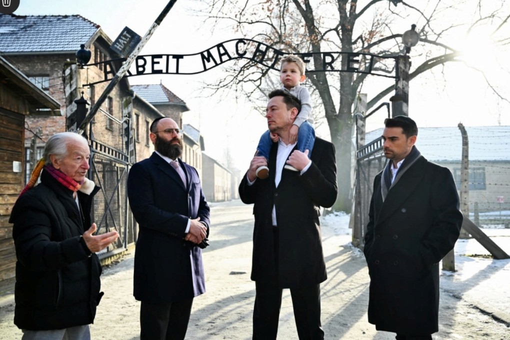 Elon Musk (second from right, with his son) takes part in a private visit to Auschwitz-Birkenau with (left to right) Holocaust survivor Gidon Lev, European Jewish Association chairman Rabbi Menachem Margolin and Ben Shapiro in Oswiecim, Poland. Photo: Reuters