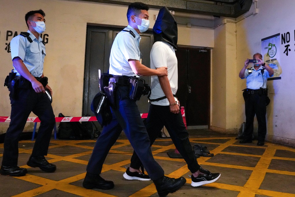 Tang Kai-yin heading to court last August. Prosecutors on Monday agreed to drop the charge of conspiracy to commit arson after he pleaded guilty to possessing illegal items. Photo: Elson Li