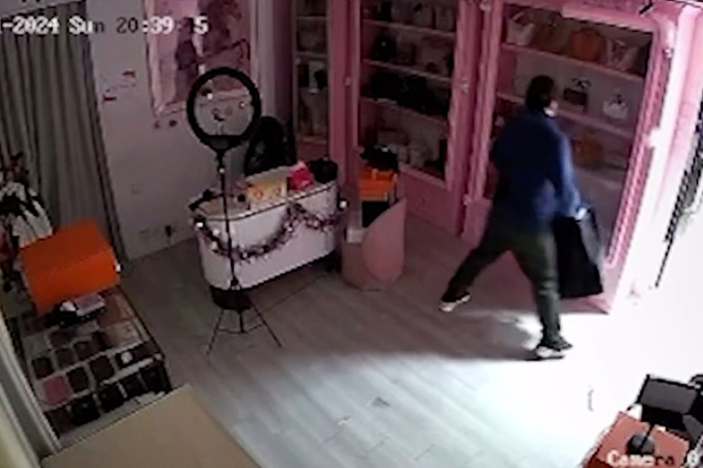 A video posted online shows a man smashing a glass door to gain entry to a store in Tsim Sha Tsui. Photo: Handout