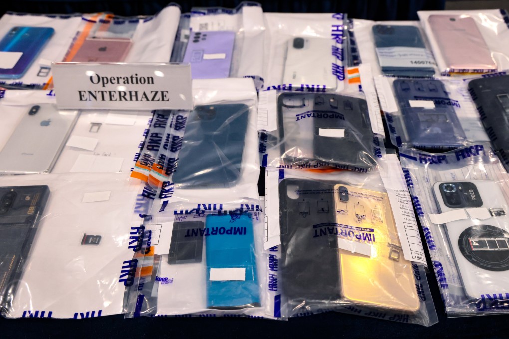 Police present evidence seized during the crackdown on fraud syndicates. The victims lost between HK$500 and HK$19 million each. Photo: May Tse