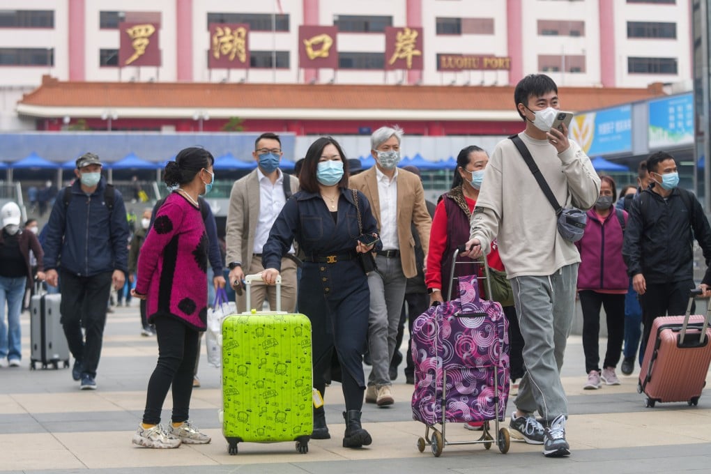 Travellers arrive at the Lo Wu border crossing in Shenzhen. The checkpoint will remain open until 2am on February 9 and 11. Photo: Sam Tsang