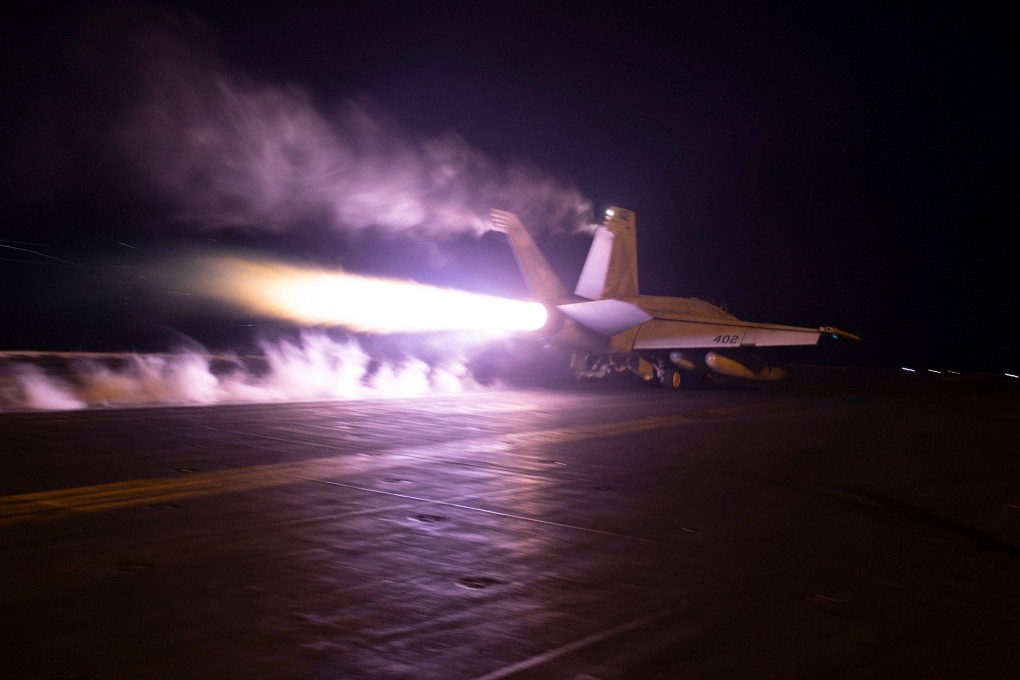A US military official said roughly 25 to 30 munitions were fired, including from warplanes launched from a US aircraft carrier. Photo: Centcom via AFP