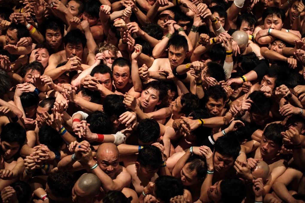 Worshippers wait for the priest to throw the sacred batons during the 2017 “naked man” festival at Saidaiji Temple in Okayama, western Japan. Photo: AFP