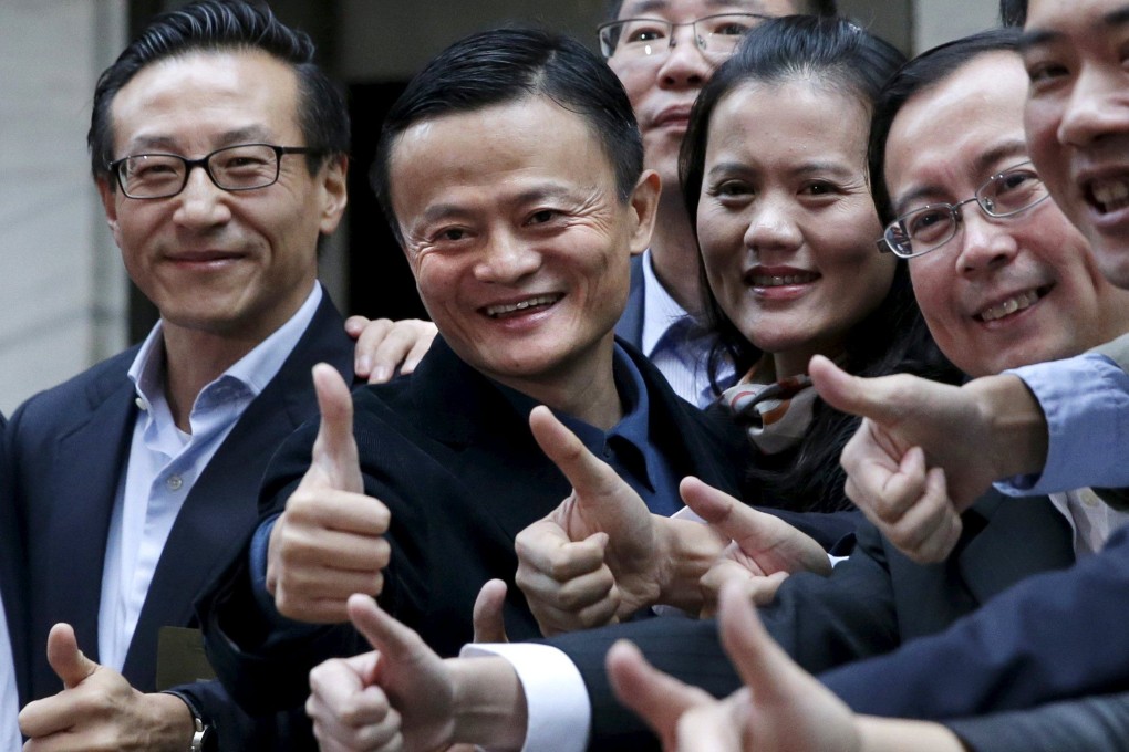 Joe Tsai (first left) and Jack Ma (second left) during the initial public offering of Alibaba Group Holding on the New York Stock Exchange on September 19, 2014. Photo: Reuters.