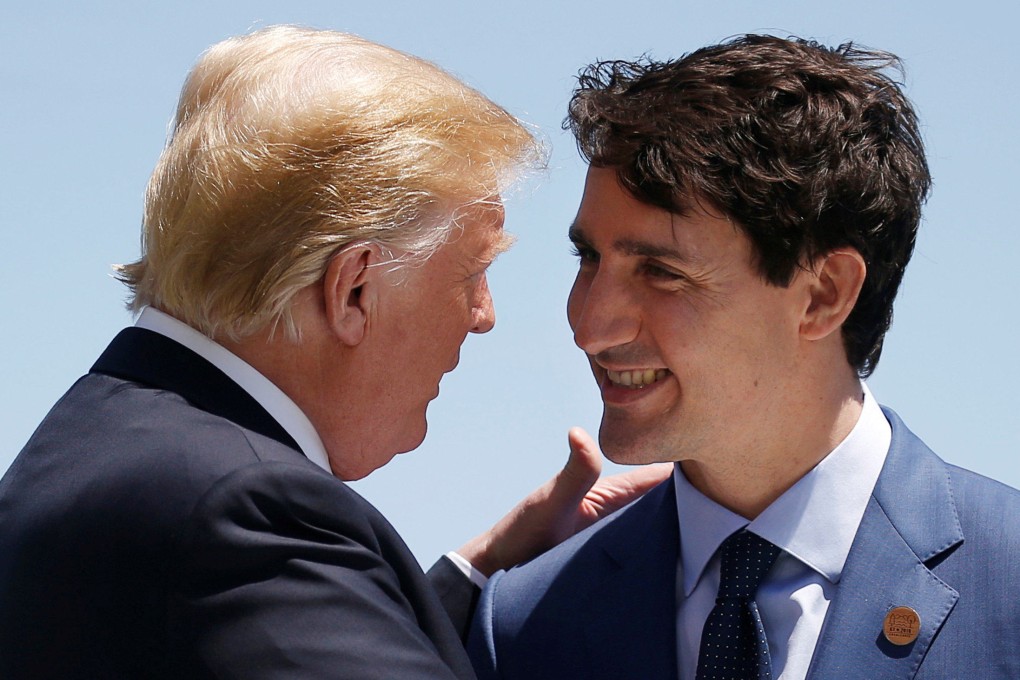 US President Donald Trump (left) is greeted by Canada’s Prime Minister Justin Trudeau as he arrives at the G7 Summit in Charlevoix, Quebec in June 2018. Photo: Reuters