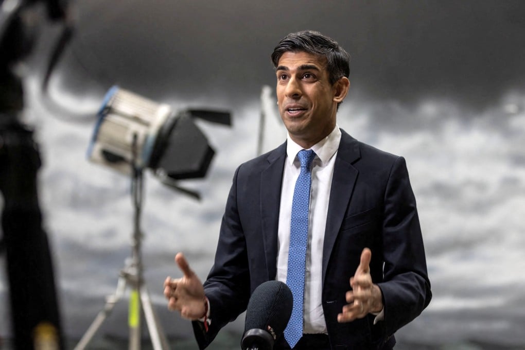 Britain’s Prime Minister Rishi Sunak gives a television interview in front of a painted backdrop of a stormy sky in Beaconsfield, Buckinghamshire, on Monday. Photo: Reuters