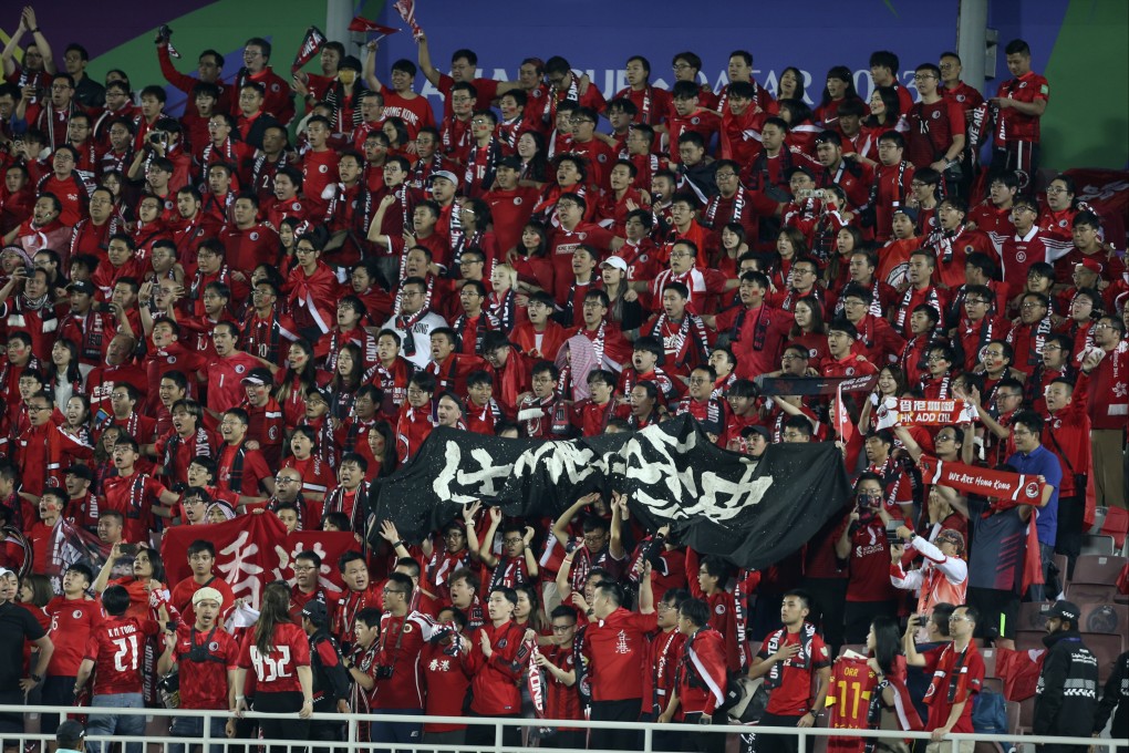 Hong Kong fans show their support at the end of the loss to Palestine in Doha. Photo: AP