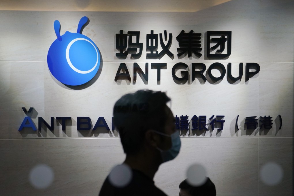 An employee passes a logo of Ant Group at its office in Hong Kong in a 2020 file photo. Photo: AP