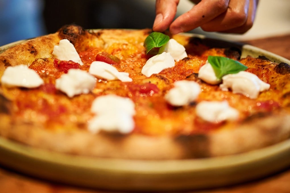 A chef prepares a pizza at The Pizza Bar on 38th, where customers have to book three months in advance. Samples of its pizza ahead of a sold-out pop-up in Hong Kong show what the fuss is about. Photo: The Pizza Bar on 38th