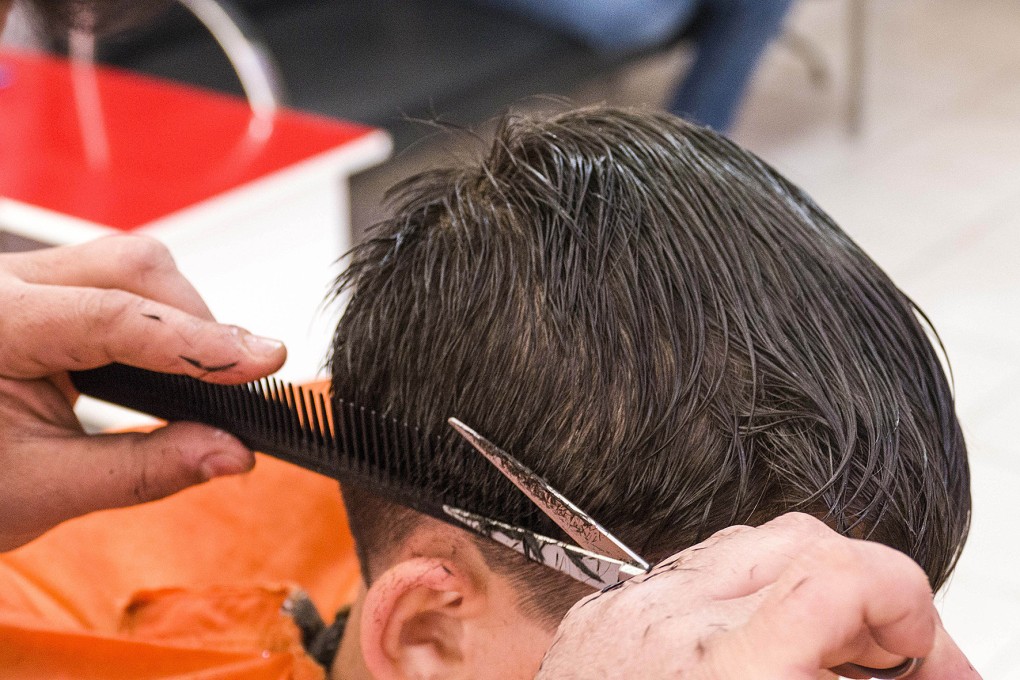 A person having a haircut. Photo: Shutterstock