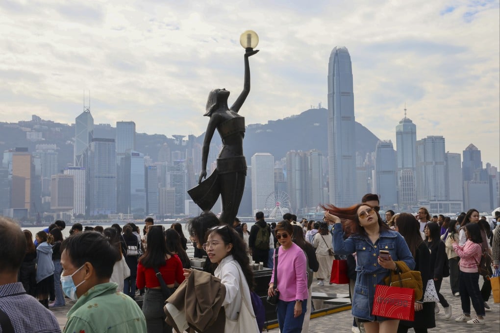 Visitors enjoy the sights at the Avenue of Stars in Hong Kong. Photo: Dickson Lee