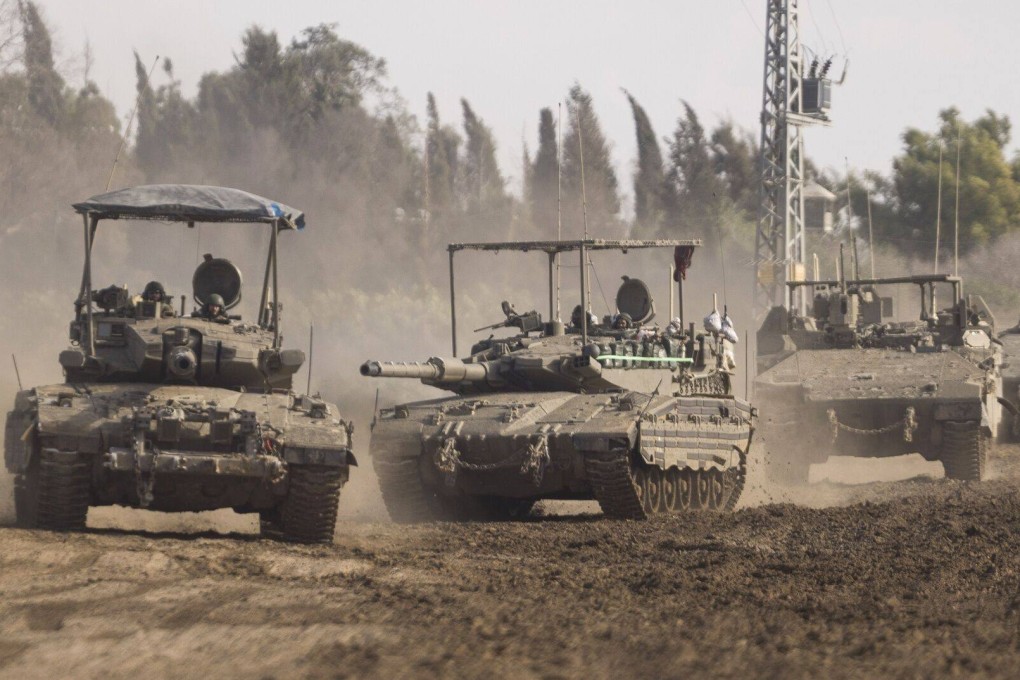 Israeli forces travel towards Gaza in tanks and armored vehicles, viewed near the Israel-Gaza border in southern Israel, on Wednesday. Photo: Bloomberg