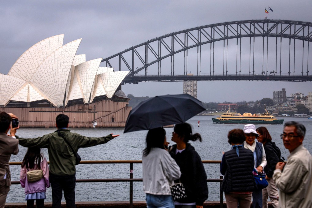 Tourists at the Sydney Opera House on December 21, 2023. Photo: AFP