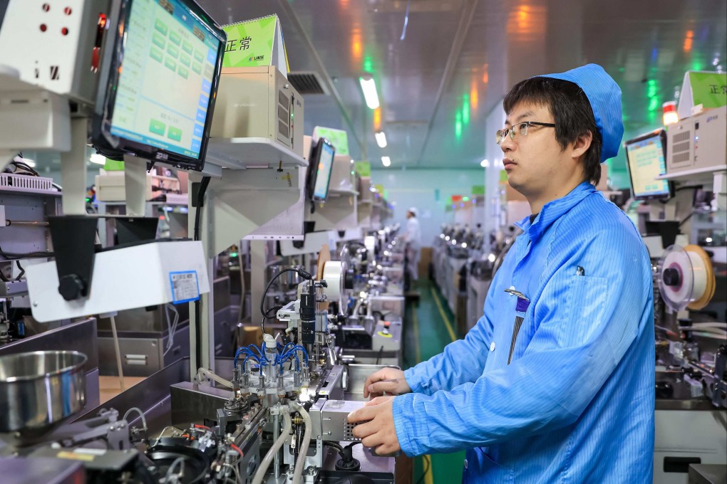 An employee works on an LED package production line at a workshop in Jiujiang, in central China’s Jiangxi province, on January 17, 2024. Photo: AFP