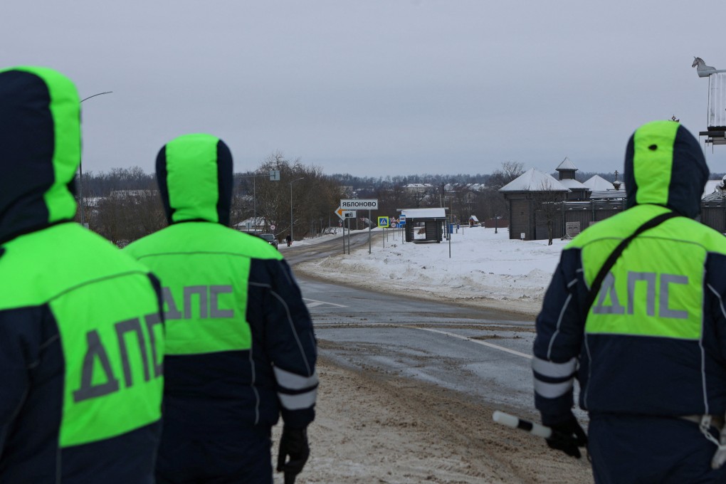 Traffic police officers block off a road near the crash site of the Russian Ilyushin Il-76 military transport plane on Wednesday. Photo: Reuters