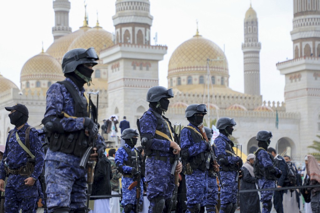 Members of Houthi security forces stand guard during an anti-Israel and anti-US rally in the Yemeni capital Sanaa on Friday. Photo: AFP/Getty Images/TNS