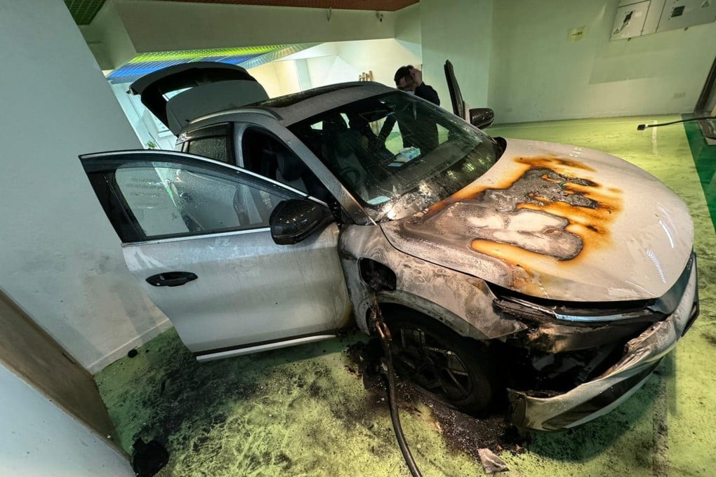 The car’s bonnet and tyre were damaged in the incident. One expert said a short circuit could be the cause of the fire. Photo: Facebook/ 電動車充電 L FB 群組