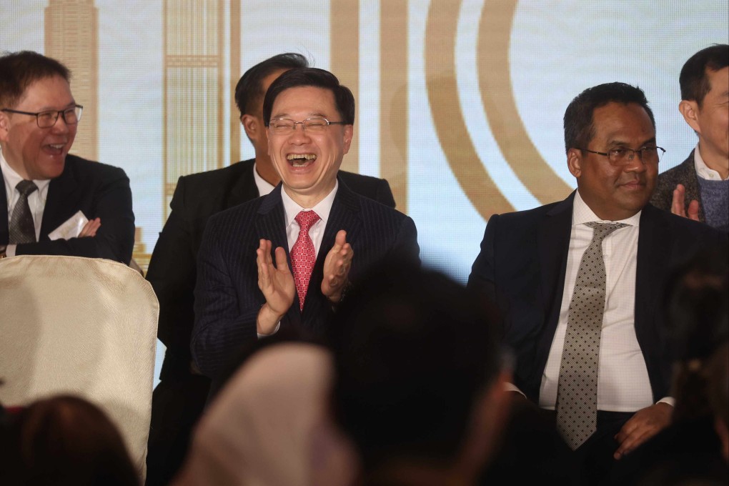 Chief Executive John Lee (in pink tie) celebrates the 10th anniversary of the Malaysian Chamber of Commerce in Hong Kong. Photo: Edmond So