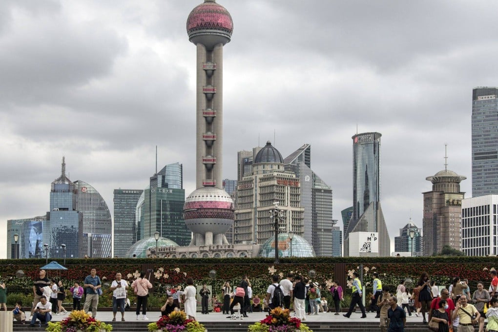 Pedestrians along the Bund in Shanghai, China. Photo: Bloomberg
