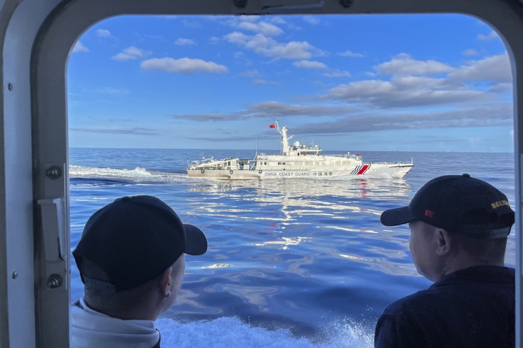 A Chinese coastguard vessel manoeuvres beside the Philippine coastguard ship BRP Cabra as they approach the contested Second Thomas Shoal in the South China Sea on November 10. Photo: AP